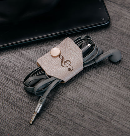 Ata cables maleta cuero beige con nota musical