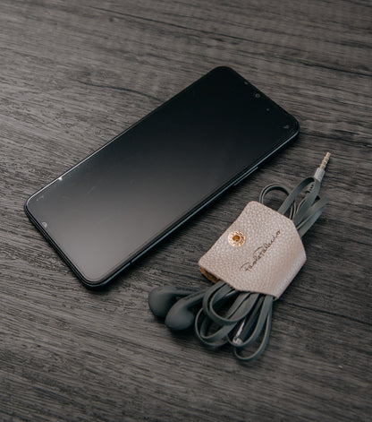 Ata cables maleta cuero beige con nota musical